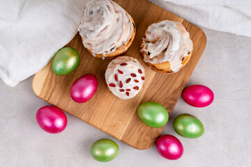 Easter cruffin cake and colored green and red Easter eggs 