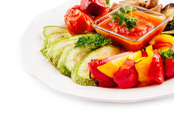 Grilled colorful vegetables on white plate
