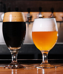 craft beer in glasses on table in pub interior