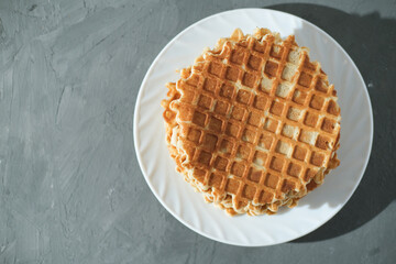 top view of round crispy italian or dutch waffels, homemade pastry, simple recipe. copy space. good morning concept.