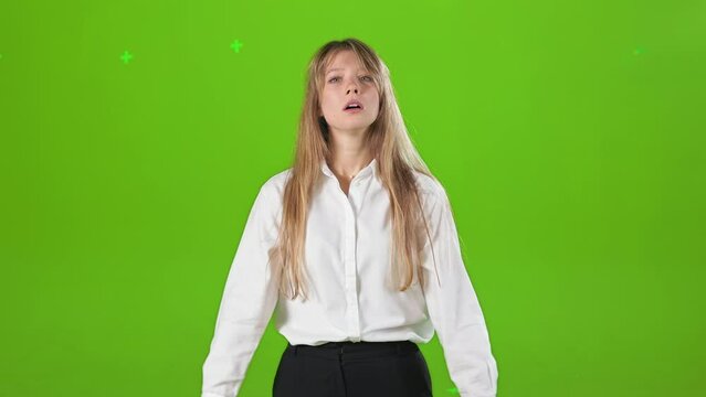 Front view of tired, busy woman standing in studio, looking at camera. Young, blonde lady wearing official clothes, working hard, having headache. Concept of modern lifestyle.