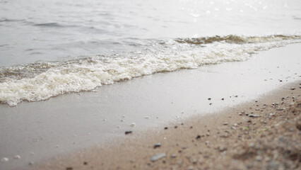 closeup shot of waves rolling on a beach on Baltic Sea