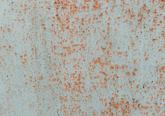 Rusty metal painted background. Rust spots and streaks on stained metal surface. Grunge industrial colored steel texture. Scratched corroded aged damaged backdrop with rustic vintage worn details.