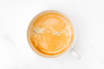 Cup of coffee latte cappuccino top view on marble table