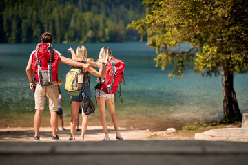 friends enjoying a day at the lake. young tourist people