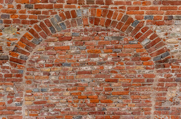 Wall texture with geometry with old red brick, brick wall with red e gray brick archway