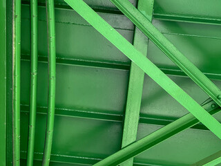 Bridge construction. Footbridge. Metal green construction.