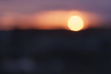 Bokeh photo of sunset over city in winter
