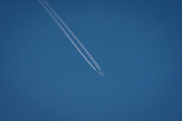 High altitude flight with contrails  