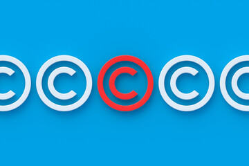 Row of white copyright symbols and one red color. Intellectual property concept. Top view. 3d render
