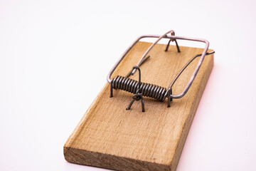 mousetrap isolated on white background. spring mousetrap with steel spring. Studio macro. Separate on a white background.