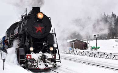 A steam locomotive with passenger train
