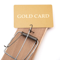 Gold credit card on a mousetrap, Financial trap, Debt, Financial problems.