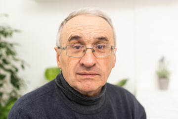Portrait elderly man on gray background
