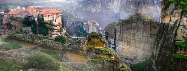 Poster Mysterious monasteries hanging over rocks of Meteora, Greece - most famous landmarks and beautiful places © Freesurf