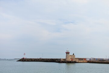 Howth Lighthouse. Harbor and marina in cloudy day in Howth, Dublin, Ireland. 