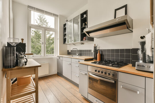 Modern kitchen interior with furniture and appliances
