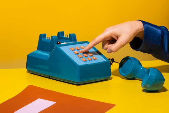 Person dialing number on phone
