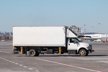 Catering truck for delivery of food to the airplane on the airport apron