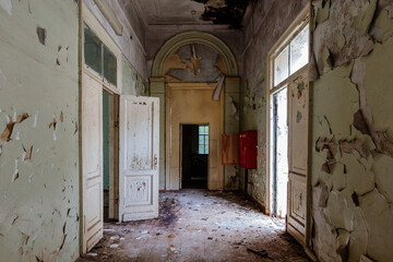 Fototapeta na wymiar Old creepy abandoned rotten ruined mental hospital