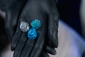 Professional cosmetologist holding plastic tips, preparing instruments for work