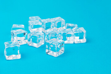 Ice cubes on blue background, Cubes of ice on a light blue background, Flat lay, top view