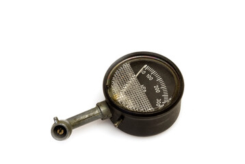 Manual pressure gauge for measuring air pressure in car tires on white background