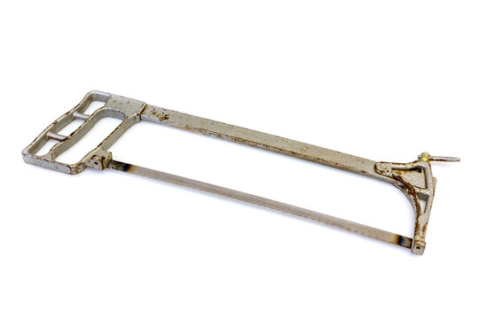 Silvery old hacksaw on a white background isolated