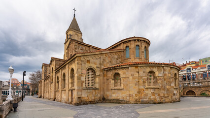 Fototapeta na wymiar Old church of San Pedro made of stone by the sea in the pretty town of Gijon, Asturias.