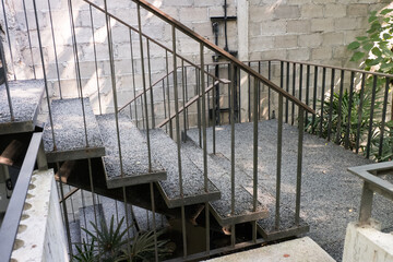 Modern metal stairway in concrete building.