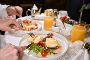 Couple having a romantic breakfast in a hotel room