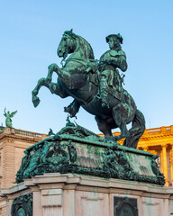 Fototapeta na wymiar Statue of Prince Eugene in front of Hofburg palace on Heldenplatz square, center of Vienna, Austria