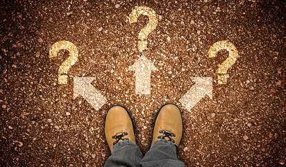 Yellow leather shoes, three arrows and question marks - problem concept