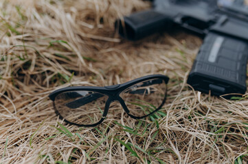 military goggles and a machine gun. military glasses