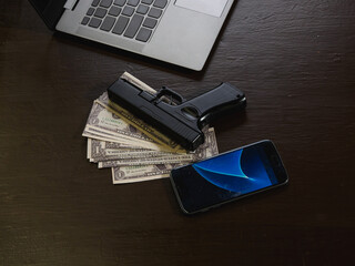Computers, mobile phone, money, guns, and other devices that hackers use to steal or hijack...