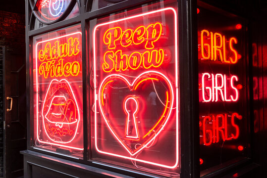 Red neon sex shop style signs on July 29, 2013 in Soho, London, UK