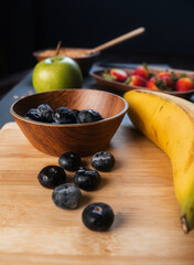 Close-up of blueberries and other fruits for the preparation of a healthy snack.