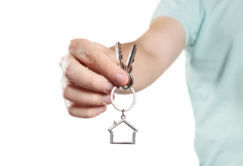 Hand holding house keys, cut out