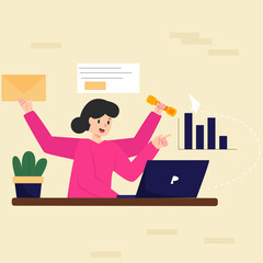 a woman wearing a pink shirt is sitting and working in front of a laptop
