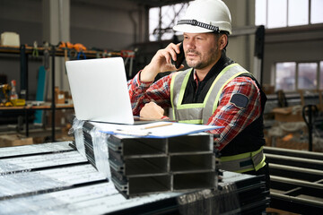Portrait of worker talking with client on phone