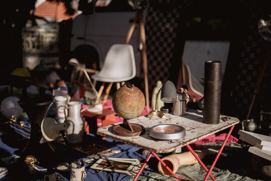 Chaotic stall with old antique glass items