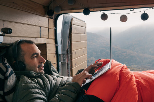 Man in bed with laptop