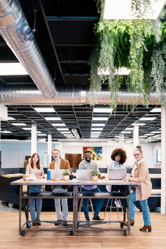 Group of diverse colleagues in coworking space
