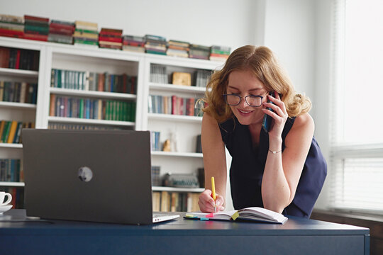 Beautiful young businesswoman at work