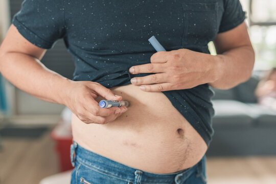 Diabetic injecting insulin. 