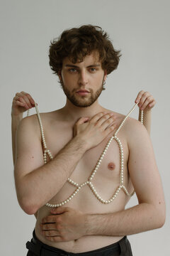 Topples curly guy with pierced nipple & hands hold bra on him