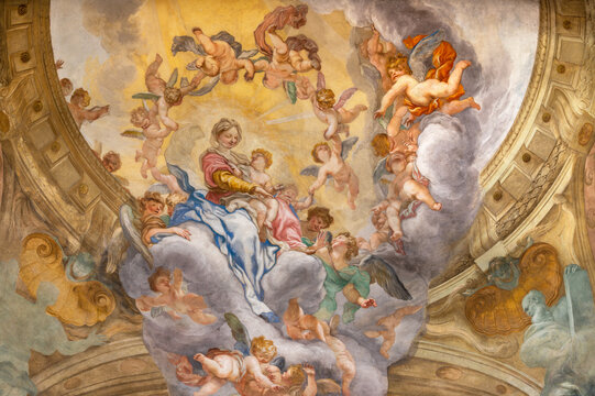 GENOVA, ITALY - MARCH 7, 2023: The fresco of Madonna among the angels in the main apse of church Chiesa di San Luca by Domenico Piola (1627 &ndash; 1703).
