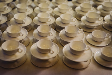 pile of empty coffee cups at night