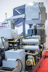 Back side of plastic recycling machine at exhibition, factory, plant. Manufacturing, production, technology concept