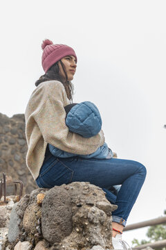 Young woman holding her child